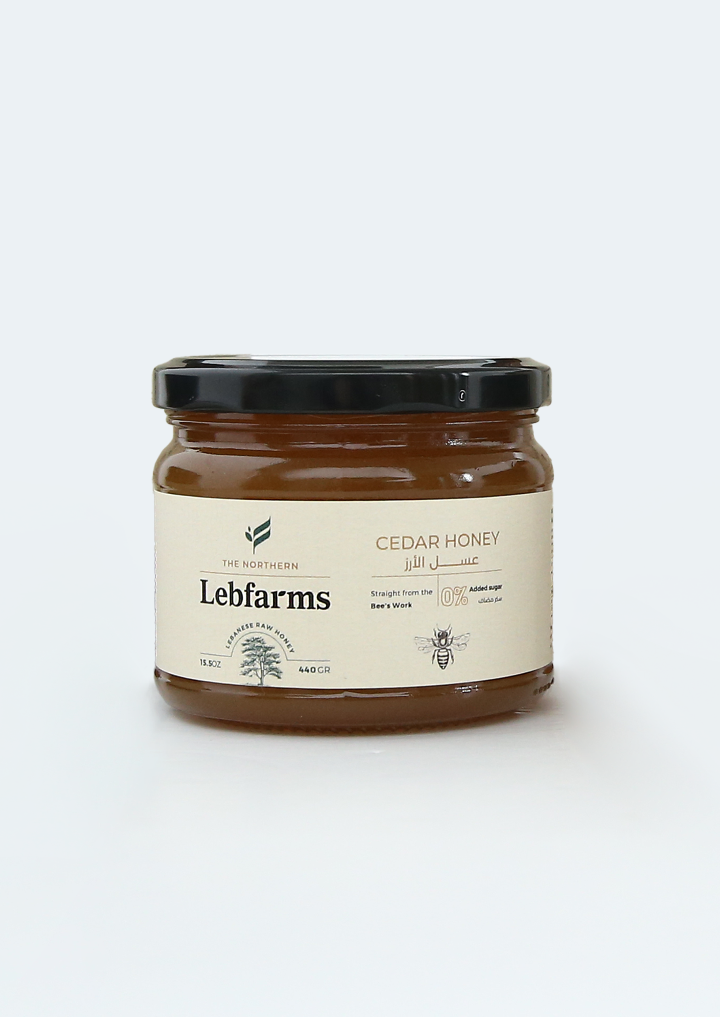 Jar of Lebfarms cedar honey on a white background