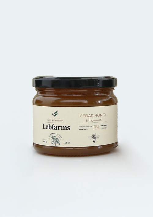 Jar of Lebfarms cedar honey on a white background